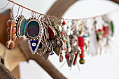 Earrings hang on string in Devon cottage England UK