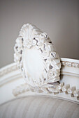 Carved headboard detail on bed in Petworth farmhouse West Sussex Kent