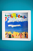 Child's artwork framed in 1950s coastal beach house West Sussex UK