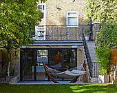 Hammock on terrace in back garden of London family townhouse  England  UK