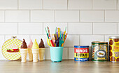 Colouring pens with fake icecream and syrup and custard in Alloa kitchen  Scotland  UK