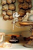 Close up of a display of antique memorabilia in cabinet
