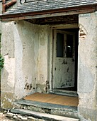 Original farmhouse entrance porch with slate roof