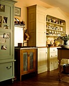 Painted kitchen dresser with stove in country kitchen