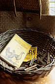 basket containing pegs and books