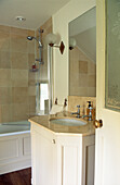 Neutral bathroom with shower screen in coach house renovation 