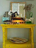 Dining room alcove with yellow table and christmas decorations and candles 