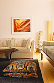 Utah inspired photography in seating area with African textiles 