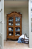 Classical ornate cabinet with crockery