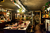 Christmas card display above dining table in Cheltenham country home Gloucestershire England UK