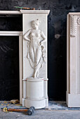 Carved female figure on marble fireplace in historic Yeovil Somerset, England, UK