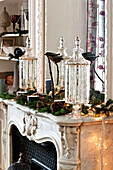 Christmas decorations on marble fireplace in Paris apartment, France