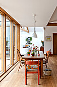 Vintage table and chairs in contemporary Hertfordshire family home, England, UK