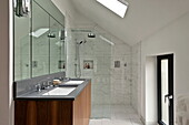 Shower screen and double basins in wet room of London home, England, UK