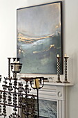 Marine artwork above fireplace in contemporary Suffolk/Essex home, England, UK