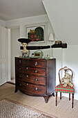 Antique wooden chest of drawers in contemporary Suffolk/Essex home, England, UK