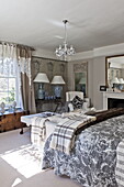 Glass chandelier in bedroom with matching lamps, Bury St Edmunds country home, Suffolk, England, UK