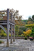 Balcony terrace in rural garden exterior in Blagdon, Somerset, England, UK