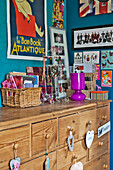 Artwork and ornaments on wooden chest in East Grinstead child's room West Sussex England UK