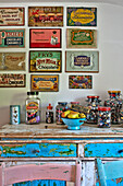 Vintage advertising and sweet jars on sideboard in Cambridge cottage England UK