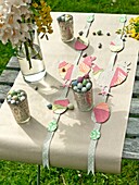 Easter eggs with cut out decorations on tabletop with brown paper in Sussex garden England UK