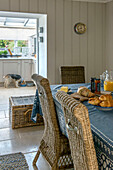 Dog eating from bowl in kitchen of Penzance farmhouse Cornwall England UK
