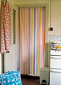 Striped curtain in kitchen door