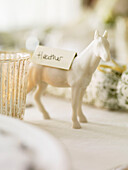 Name card on horse as table decoration