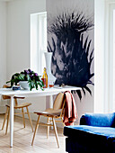 Large thistle artwork and table with chairs for two