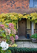 Wellington boots at porch entrance to Cranbrook family home, Kent, England, UK