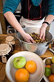 Woman mixing mincemeat in Tenterden kitchen, Kent, England, UK