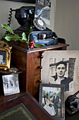 Family photographs and rotary dial telephone in Tenterden home, Kent, England, UK
