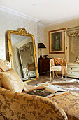Full length gilt-framed mirror in bedroom of Kent home England UK