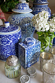 Blue and white ceramic urns with candle holders in Bishops Sutton home Alresford Hampshire England UK