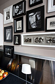 Black and white photographs in kitchen with metallic splashback Hove East Sussex UK