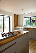 Chocolate brownies on a cooling tray in kitchen of contemporary London home, England, UK