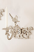 Wall mounted metalwork candle holder in Berkshire home, England, UK