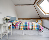 Patterned duvet in attic bedroom conversion is Sussex home