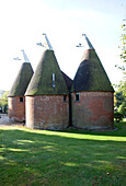 Conical roof of traditional brick oast house or hop kiln in Kent England UK