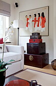 Vintage chests and artwork in living room detail of contemporary London home, England, UK