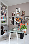 Artwork and book storage in home office in contemporary London home, UK