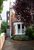 Brick exterior and driveway of London home England UK