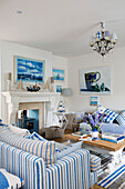 Striped sofas with wooden coffee table in living room of Dulwich home, London, England, UK