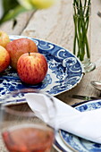 Fresh apples on blue and white chinaware in historic Sussex country home England UK