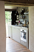 Coffee pot on workbench in kitchen of Brittany cottage Western France