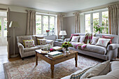 Wooden coffee table in living room of Sussex Downs home, England, UK