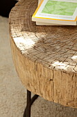 Books on wooden side table in contemporary home, Kingston upon Thames, England, UK