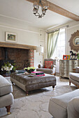 Ceiling beam above ottoman in living room of London home England UK