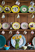 Collection of chinaware on wooden dresser in London home England UK