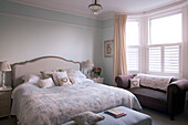 Cut glass chandelier above double bed in Shoreham by Sea home   West Susses   England   UK